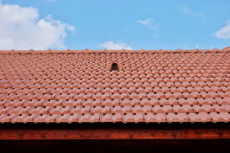 Your Attic Is a Furnace in July — And Your Shingles Are Paying the Price